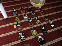  Boys keeping a safe distance from each other,attend a Koran memorization class as Palestinians ease the coronavirus disease (COVID-19) rest...