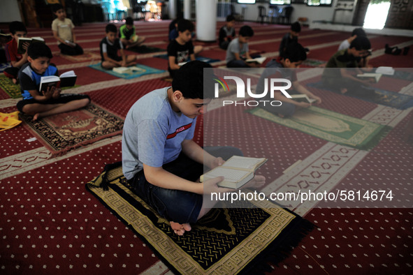  Boys keeping a safe distance from each other,attend a Koran memorization class as Palestinians ease the coronavirus disease (COVID-19) rest...