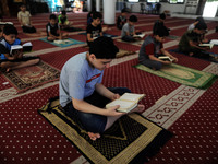  Boys keeping a safe distance from each other,attend a Koran memorization class as Palestinians ease the coronavirus disease (COVID-19) rest...