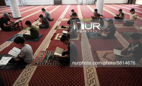  Boys keeping a safe distance from each other,attend a Koran memorization class as Palestinians ease the coronavirus disease (COVID-19) rest...