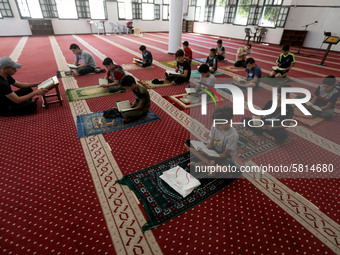  Boys keeping a safe distance from each other,attend a Koran memorization class as Palestinians ease the coronavirus disease (COVID-19) rest...