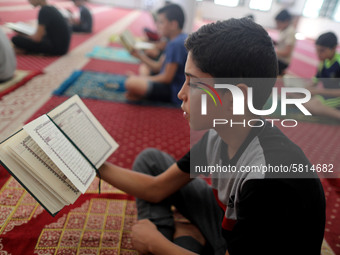  Boys keeping a safe distance from each other,attend a Koran memorization class as Palestinians ease the coronavirus disease (COVID-19) rest...