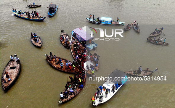 Rescue workers carry bodies of victims following the Launch capsized in Buriganga River in Dhaka, Bangladesh, on June 29, 2020. At least 30...
