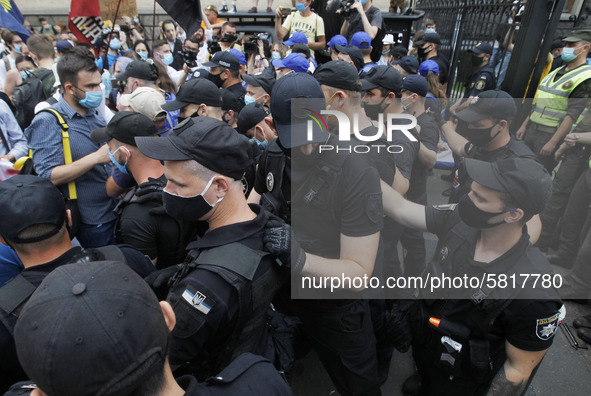 Police officers stand guard, during a rally of Ukrainian students against the appointment of acting Minister of Education and Science of Ukr...