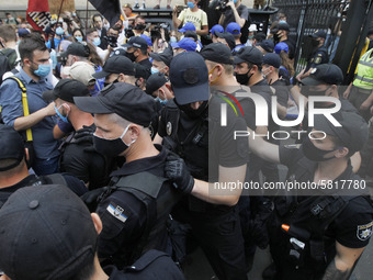 Police officers stand guard, during a rally of Ukrainian students against the appointment of acting Minister of Education and Science of Ukr...