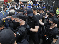 Police officers stand guard, during a rally of Ukrainian students against the appointment of acting Minister of Education and Science of Ukr...