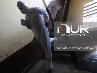 A healthcare worker walks down the stairs during a medical check-up in Mumbai, India on July 01, 2020. India is the fourth worst-hit nation...