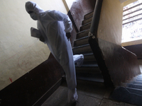 A healthcare worker walks down the stairs during a medical check-up in Mumbai, India on July 01, 2020. India is the fourth worst-hit nation...