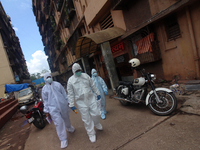 Healthcare workers leave after conducting a medical check-up in Mumbai, India on July 01, 2020. India is the fourth worst-hit nation by the...