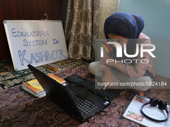 A Student self studies at her home during Covid-19 (coronavirus) pandemic in Sopore Town of District Baramulla Jammu and Kashmir,  India on...