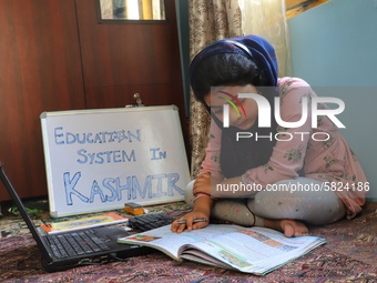 A Student self studies at her home during Covid-19 (coronavirus) pandemic in Sopore Town of District Baramulla Jammu and Kashmir,  India on...