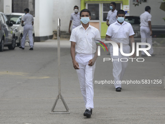 Student wearing facemask walk along in school in Colombo, Sri Lanka July 7, 2020
Sri Lankan Government announced the reopening of school fo...