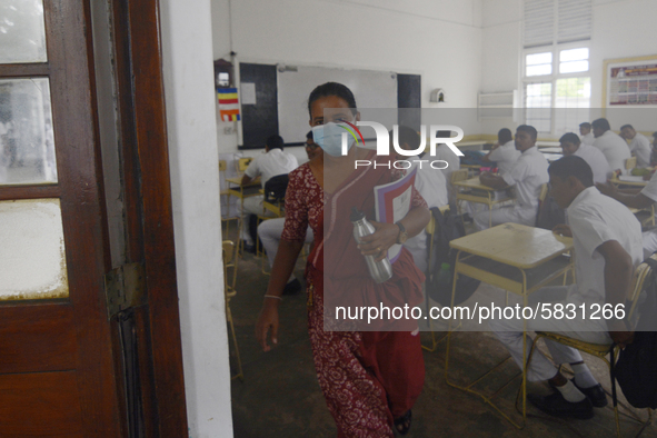 A teacher came outside near the classroom in Colombo, Sri Lanka July,7,2020
Sri Lankan Government announced the reopening of school for stu...