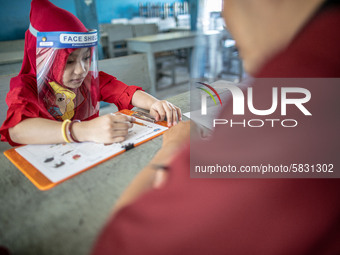 A little girl during her test for school selection test at Depok, West Java, Indonesia, on July 6, 2020.  The Education and Culture Ministry...