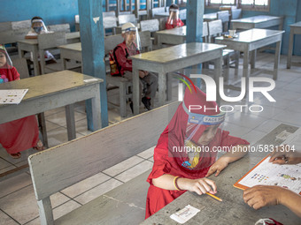 A little girl during her psychological test for selection entering the school at Depok, West Java, Indonesia, on July 6, 2020.  The Educatio...