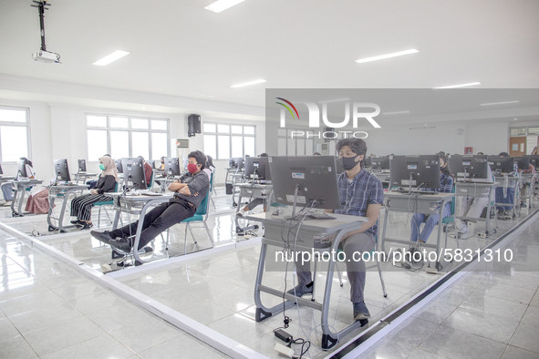 Participants waiting for the test to begin at a campus in the National State University selection test in Depok, West Java, Indonesia, on Ju...