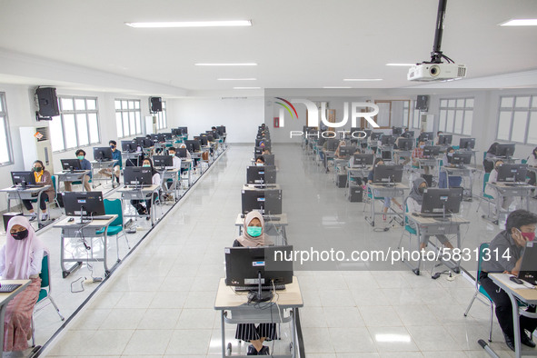 Participants waiting for the test to begin at a campus in the National State University selection test in Depok, West Java, Indonesia, on Ju...