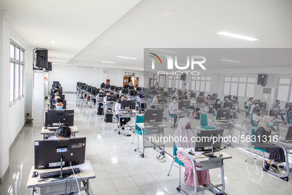 Participants waiting for the test to begin at a campus in the National State University selection test in Depok, West Java, Indonesia, on Ju...