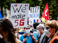 Several hundred employees of the Nokia group, including those at the Lannion plant, gathered in Paris, France, on July 8, 2020 for a large d...