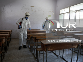 Members of civil defense known as white helmets sterilize school classes after discovering 3 COVID-19 cases in Idlib, Syria on July 11, 2020...