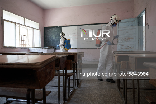 Members of civil defense known as white helmets sterilize school classes after discovering 3 COVID-19 cases in Idlib, Syria on July 11, 2020...