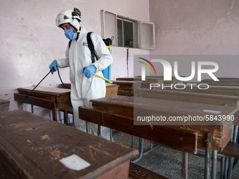 Members of civil defense known as white helmets sterilize school classes after discovering 3 COVID-19 cases in Idlib, Syria on July 11, 2020...