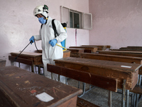 Members of civil defense known as white helmets sterilize school classes after discovering 3 COVID-19 cases in Idlib, Syria on July 11, 2020...