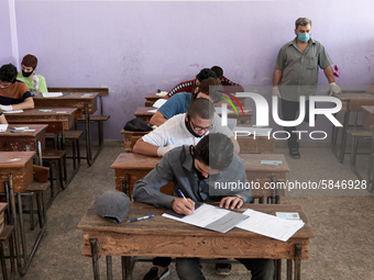 Syrian students in Idlib province take the middle school exam while maintaining safety procedures against the Coronavirus on July 12, 2020 (