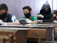 Syrian students in Idlib province take the middle school exam while maintaining safety procedures against the Coronavirus on July 12, 2020 (