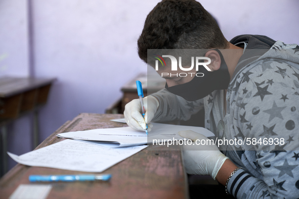 Syrian students in Idlib province take the middle school exam while maintaining safety procedures against the Coronavirus on July 12, 2020 