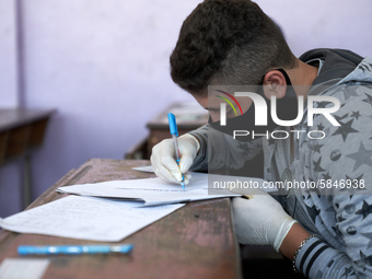 Syrian students in Idlib province take the middle school exam while maintaining safety procedures against the Coronavirus on July 12, 2020 (