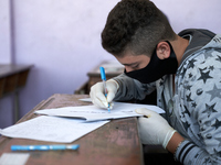 Syrian students in Idlib province take the middle school exam while maintaining safety procedures against the Coronavirus on July 12, 2020 (