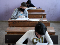 Syrian students in Idlib province take the middle school exam while maintaining safety procedures against the Coronavirus on July 12, 2020 (