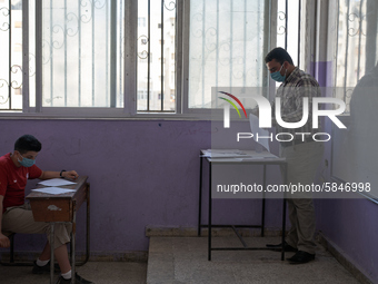 Syrian students in Idlib province take the middle school exam while maintaining safety procedures against the Coronavirus on July 12, 2020 (