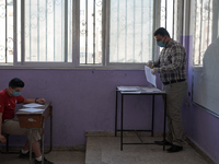 Syrian students in Idlib province take the middle school exam while maintaining safety procedures against the Coronavirus on July 12, 2020 (