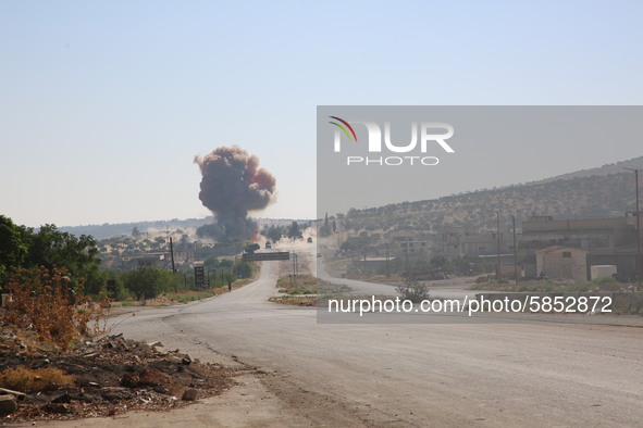 Smoke rises on the Aleppo-Latakia highway near the city of Jericho in northwestern Syria on July 14, 2020, due to a car bomb explosion while...