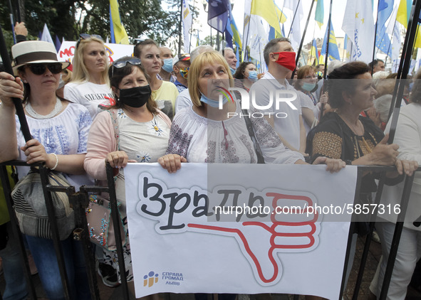 Ukrainians take part at a rally in support Ukrainian language and against a bill which offers to extend the use of the Russian language in U...