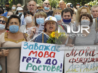 Ukrainians take part at a rally in support Ukrainian language and against a bill which offers to extend the use of the Russian language in U...