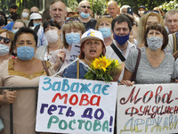 Ukrainians take part at a rally in support Ukrainian language and against a bill which offers to extend the use of the Russian language in U...