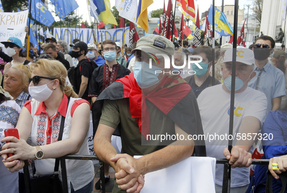 Ukrainians take part at a rally in support Ukrainian language and against a bill which offers to extend the use of the Russian language in U...