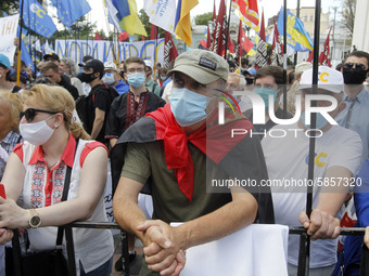 Ukrainians take part at a rally in support Ukrainian language and against a bill which offers to extend the use of the Russian language in U...