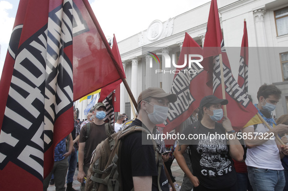 Ukrainians take part at a rally in support Ukrainian language and against a bill which offers to extend the use of the Russian language in U...