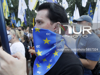 Ukrainians take part at a rally in support Ukrainian language and against a bill which offers to extend the use of the Russian language in U...