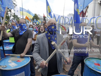 Ukrainians take part at a rally in support Ukrainian language and against a bill which offers to extend the use of the Russian language in U...