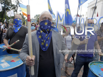 Ukrainians take part at a rally in support Ukrainian language and against a bill which offers to extend the use of the Russian language in U...