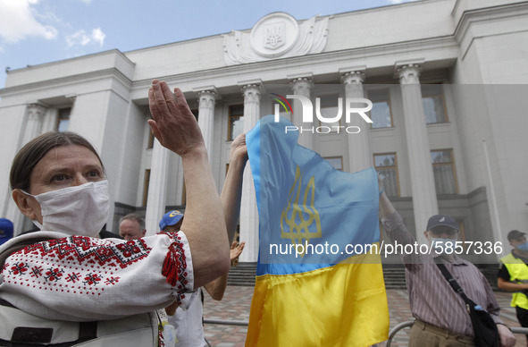 Ukrainians take part at a rally in support Ukrainian language and against a bill which offers to extend the use of the Russian language in U...