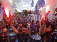 Ukrainians burn flares during a rally in support Ukrainian language and against a bill which offers to extend the use of the Russian languag...