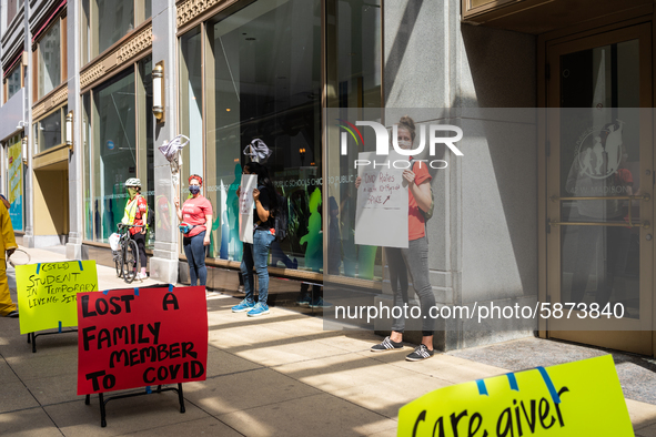 Chicago Teachers Union members and supporters protest during a car caravan outside Chicago Public Schools (CPS) headquarters while a Chicago...