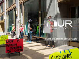 Chicago Teachers Union members and supporters protest during a car caravan outside Chicago Public Schools (CPS) headquarters while a Chicago...