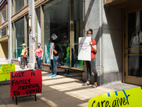 Chicago Teachers Union members and supporters protest during a car caravan outside Chicago Public Schools (CPS) headquarters while a Chicago...